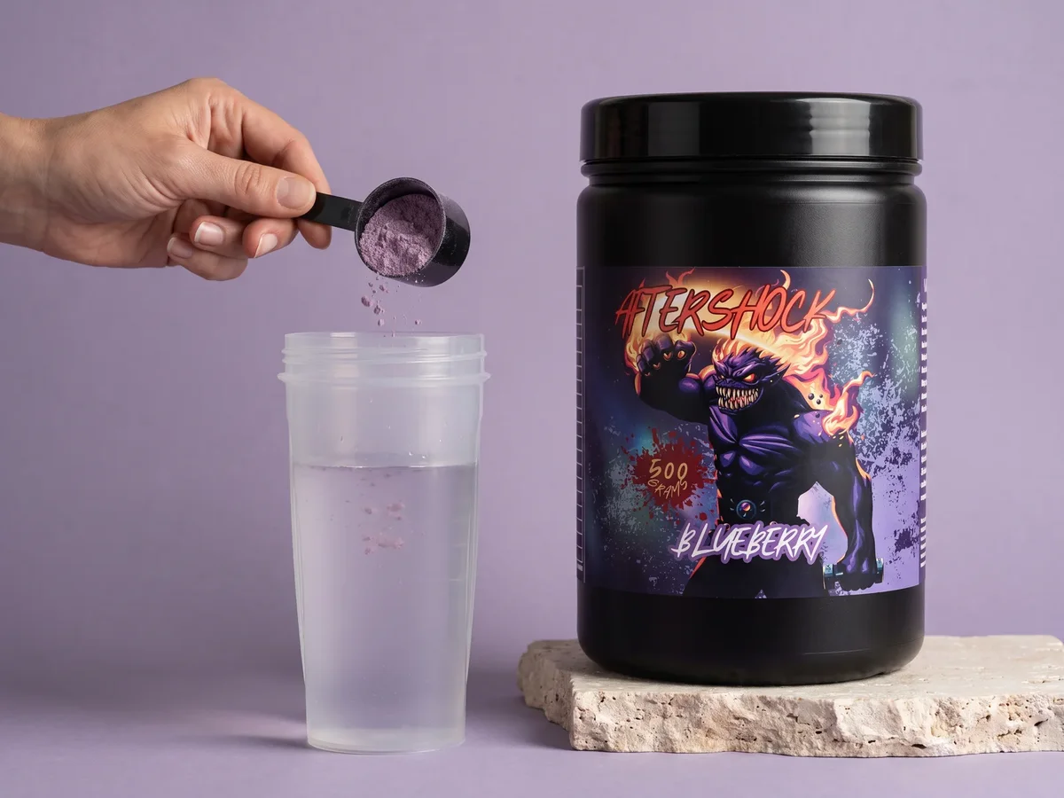 A scoop of Aftershock poured into a shaker with water
