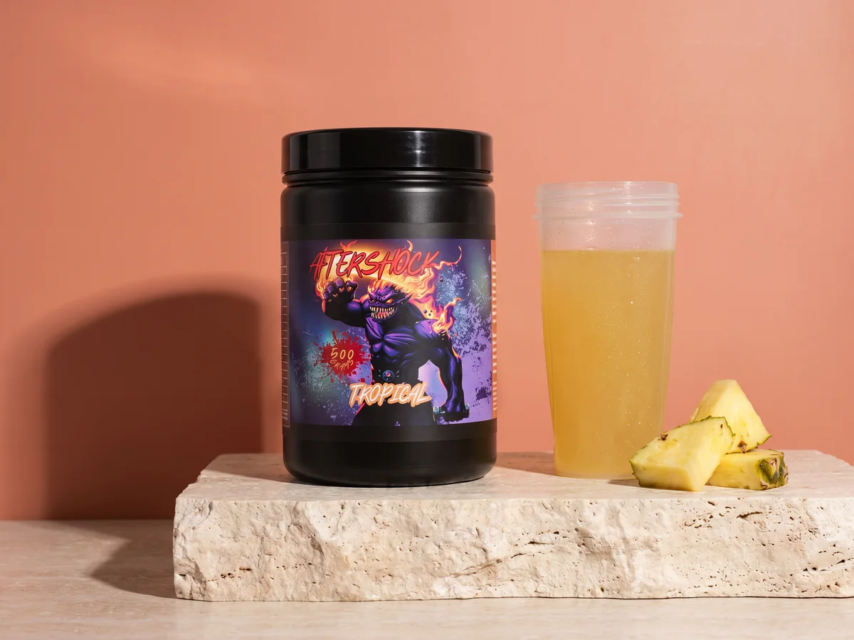Aftershock tub next to a shaker with the mixed drink
